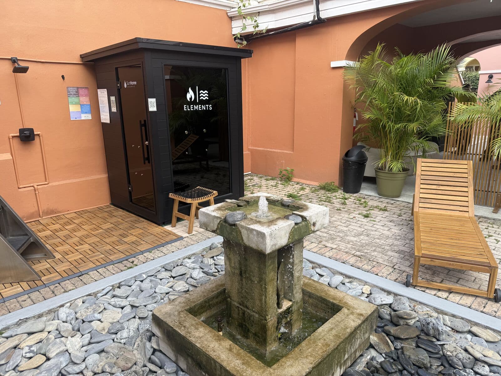 The courtyard fountain and sauna door