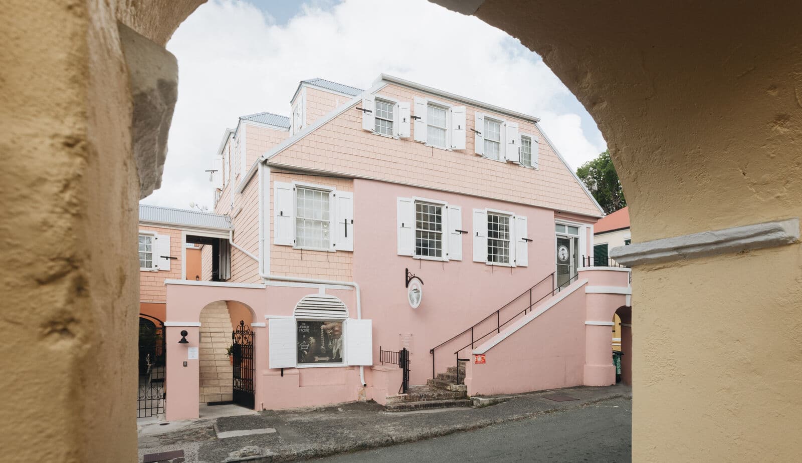 The building through the courtyard arch